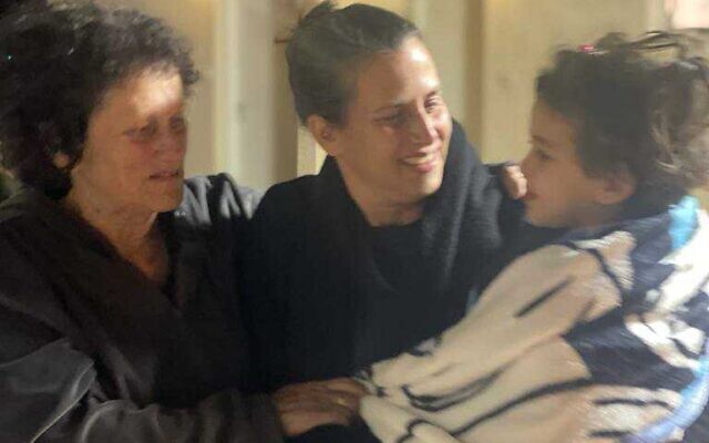 Avigail Idan reunites for the first time with her aunt Liron and her grandmother Shlomit after her release from Hamas captivity on November 26, 2023, at the Hatzerim Air Base. (Courtesy)