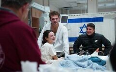 The reunion of siblings Maya and Itay Regev, released from Gaza days apart, with a third sibling at Soroka Medical Center in Beersheba, November 30, 2023, in handout photos by the hospital. (Courtesy)
