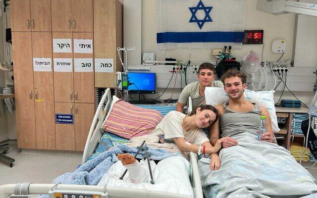 The reunion of siblings Maya and Itay Regev, released from Gaza days apart, with a third sibling at Soroka Medical Center in Beersheba, November 30, 2023, in handout photos by the hospital. (Courtesy)
