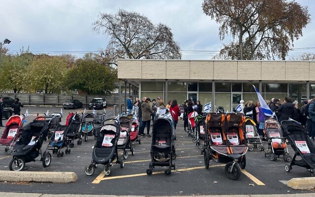 Empty strollers are displayed at a demonstration in Skokie, Illinois, to highlight the Israeli children being held hostage in Gaza by Palestinian terrorists.  (Times of Israel)