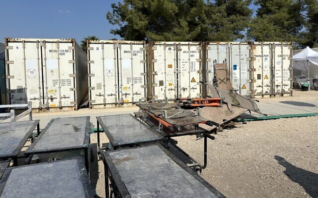 Refrigerated containers holding bodies at Israel's makeshift mass casualty morgue at Shura Base, October 31, 2023. (Carrie Keller-Lynn/Times of Israel)