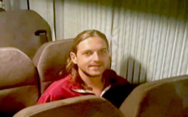Russian-Israeli Roni Krivoi is seen inside the International Red Cross vehicle at the Rafah border crossing with Egypt ahead of his transfer to Israel on November 26, 2023. (Screenshot)