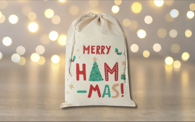 A ham bag with the slogan Merry Ham-mas has been pulled from Kmart shelves in Australia. (Image via K-Mart.com.au via WebArchive. Design by Jackie Hajdenberg/JTA)