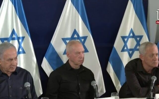 From left: Prime Minister Benjamin Netanyahu, Defense Minister Yoav Gallant and Minister Benny Gantz at a televised press conference on November  18, 2023 (Channel 12/GPO Screenshot)