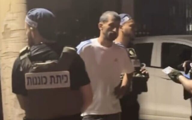 An Arab Israeli is detained by a civilian security squad in Tel Aviv on November 9, 2023. (Screen capture/X)