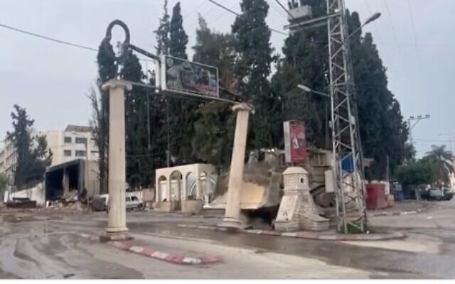 An IDF bulldozer destroys a monument for the late PLO chairman Yasser Arafat at the entrance to the Tulkarem refugee camp in the West Bank on November 14, 2023. (Screen capture/X)