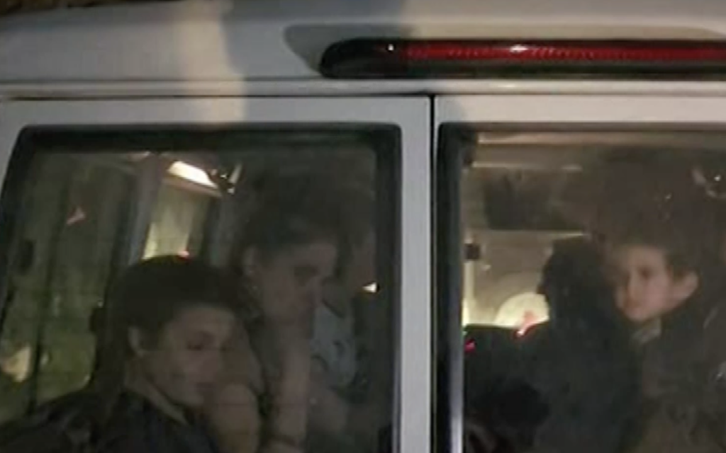 4-year-old Avigail Idan (right) seen in a Red Cross ambulance along with Chen Almog Goldstein and one of her sons, after being released by Hamas on the third day of the 4-day truce with Israel, November 26, 2023. (Screenshot)
