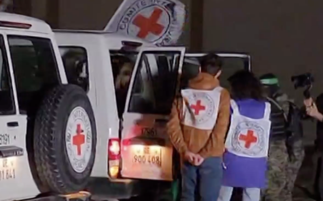 Hostages released by Hamas on the fourth day of the ceasefire with Israel are transferred to the Red Cross inside Gaza ahead of their return to Israel via Egypt, November 27, 2023. (Screenshot)