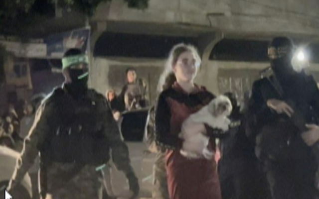 Mia Leimberg, 17, seen in footage from inside the Gaza Strip, with her dog Bella, as she is transferred to the Red Cross as part of a hostage deal between Israel and Hamas, October 28, 2023. (November 28, 2023)