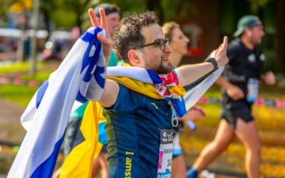 Syrian immigrant Shevan ran the Amsterdam Marathon with Israeli, Palestinian and Ukrainian flags. (Courtesy of Shevan via JTA)