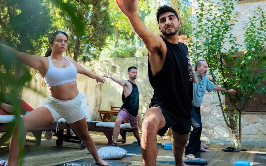 Supernova party survivors do yoga at the Secret Forest retreat center in Cyprus, in an undated photo. (courtesy)