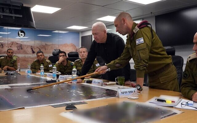 Defense Minister Yoav Gallant (center) is seen with IDF Southern Command chief Maj. Gen. Yaron Finkelman (right) and other officers at the Southern Command HQ in Beersheba, November 3, 2023. (Ariel Hermoni/Defense Ministry)