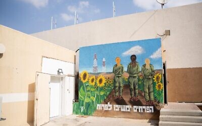 A mural is seen outside an IDF surveillance command center at the Re'im base. The text reads: 'The flowers will continue to bloom.' November 5, 2023. (Israel Defense Forces)