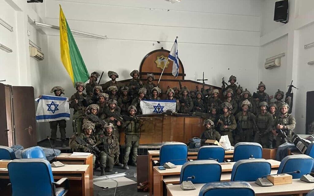Troops from the IDF's Golani Brigade pose for a photo inside Gaza's parliament building in Gaza City, after capturing the site, on November 13, 2023. (Social media; used in accordance with Clause 27a of the Copyright Law)
