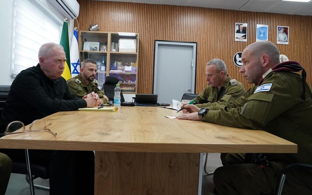 Defense Minister Yoav Gallant (right) holds an assessment with military officials at the IDF Gaza Division base in southern Israel, November 21, 2023. (Ariel Hermoni/Defense Ministry)