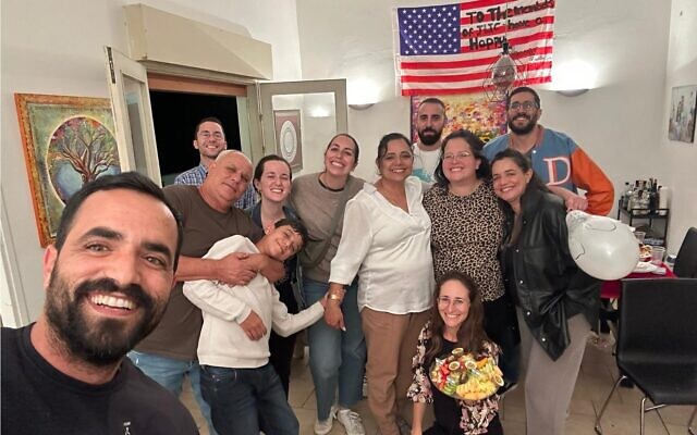 The Weinstein and Dahan families, plus guests, at a Thanksgiving dinner event in Tel Aviv, on November 22, 2023. (courtesy)