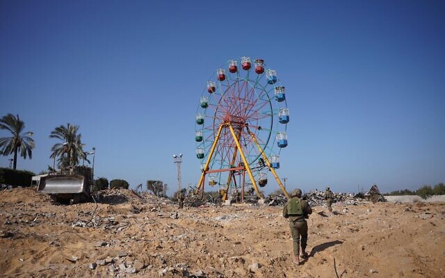 IDF troops operate near the site of a Hamas tunnel near a ferris wheel in the northern Gaza Strip, in an image published November 7, 2023. (Israel Defense Forces)