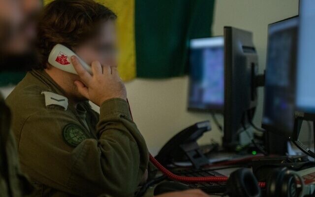 Soldiers of an IDF Military Intelligence Directorate team for the Golani Infantry Brigade are seen working at computers, in a handout photo published November 12, 2023. (Israel Defense Forces)