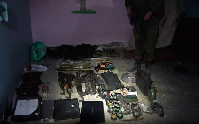 Weapons found by IDF forces in a Hamas command center underneath Gaza City's Rantisi Hospital, in a photo released by the military on November 13, 2023. (Israel Defense Forces)