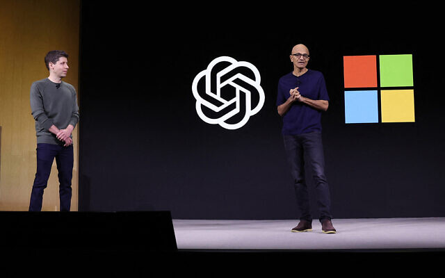 Microsoft CEO Satya Nadella (R) speaks as OpenAI CEO Sam Altman (L) looks on during the OpenAI DevDay event on November 06, 2023 in San Francisco, California. (Justin Sullivan/Getty Images North America/Getty Images via AFP)