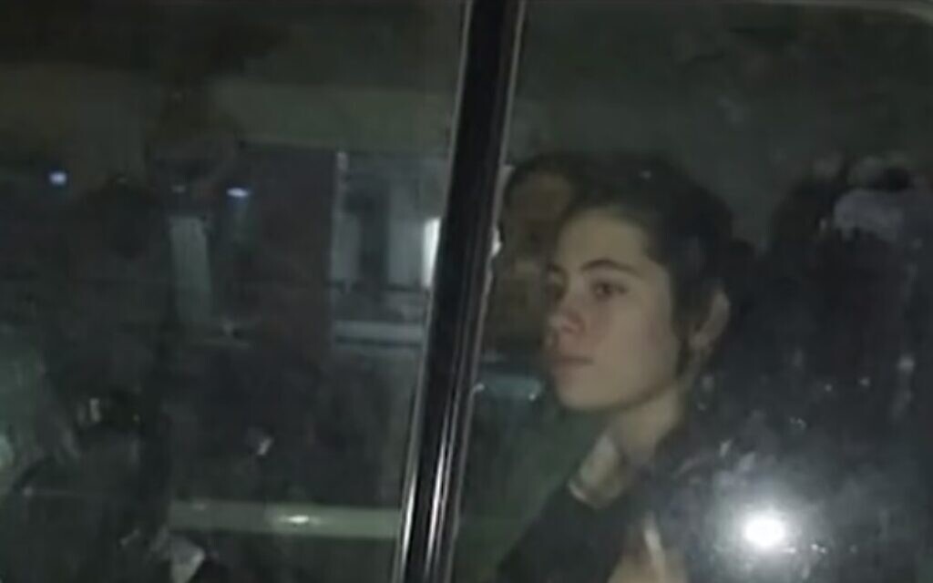 Hamas hostage Dafna Elyakim is seen in a Red Cross vehicle as she is handed over to Israel, November 26, 2023 (Video screenshot)