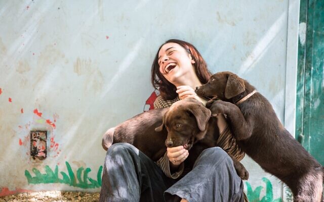 Interacting with puppies at Beit Daniella, west of Jerusalem. (Courtesy, Beit Daniella)