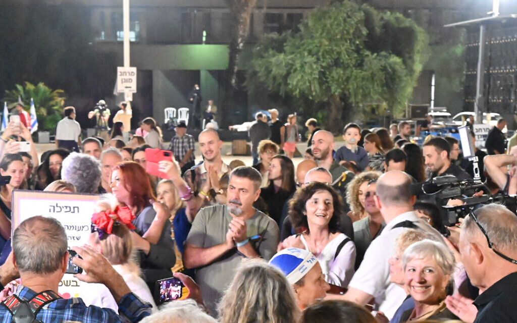 Visitors sing and dance at the weekly Kabalat Shabbat on Tel Aviv's Hostages Square on November 25, 2023. (Canaan Lidor/Times of Israel)