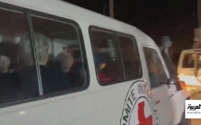 An International Red Cross Ambulance apparently carrying Israeli hostages -- elderly women and at least one children held in the Gaza Strip on November 24, 2023 (Screen grab via Al Arabiya used in accordance with Clause 27a of the Copyright Law)