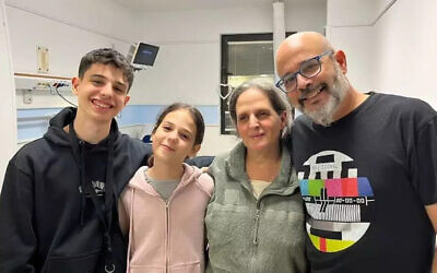 Sharon Avigdori and her daughter Noam are reunited with husband and father Hen Avigdori and their son Omer Avigdori after Sharon and Noam were released by Hamas from captivity in Gaza on Saturday, November 25, 2023. (Courtesy Avigdori family)