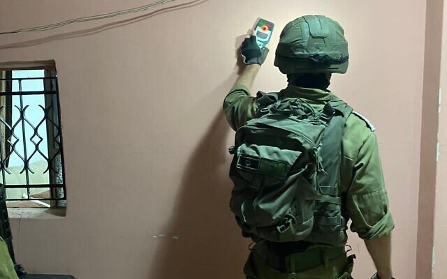 Israeli forces map the home of the Palestinian teen who fatally stabbed a Border Police officer in the Old City of Jerusalem on November 6, in the West Bank town of Sa'ir, November 7, 2023. (Israel Defense Forces)