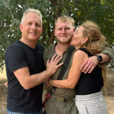 The late Shachar Friedman, center, and his parents, before he entered Gaza. (Facebook screen capture, used in accordance with Clause 27a of the Copyright Law)