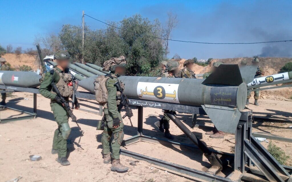 Israeli soldiers inspect Iran-made Badr-3 rockets at an Islamic Jihad outpost in northern Gaza on November 17, 2023 (IDF)