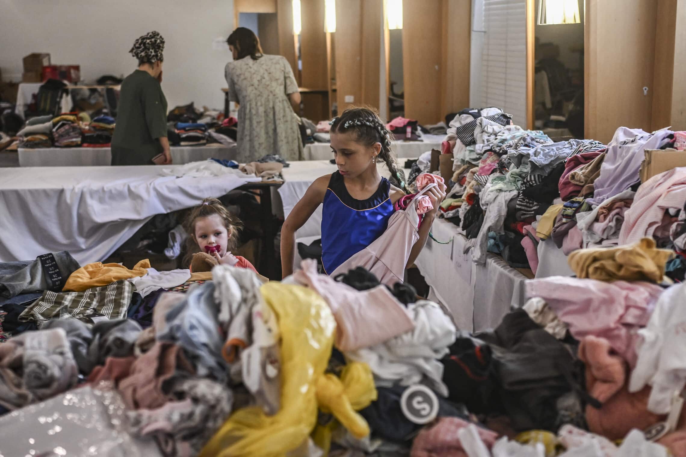 Illustrative: Israeli evacuees from the Gaza border area get temporary shelter at a hotel in Eilat, October 17, 2023. (Aris MESSINIS / AFP)