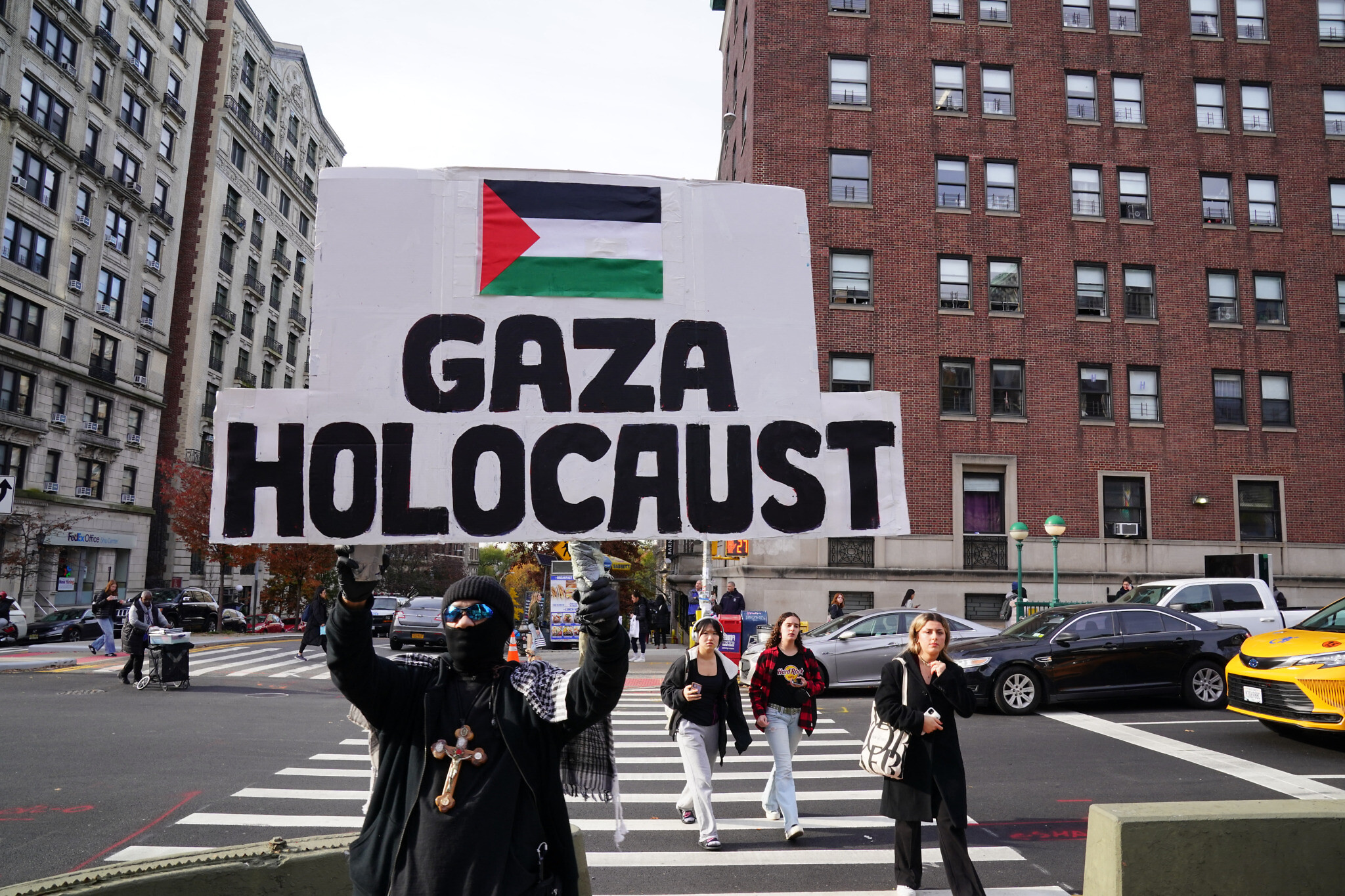 A demonstrator holds a sign at the 'All out for Gaza' protest at Columbia University in New York City on November 15, 2023. (Photo by Bryan R. Smith / AFP)