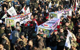 Iraqi soldiers from the Hashed al-Shaabi (Popular Mobilization) forces carry the coffins of fighters killed in a US strike earlier in the day, during a funeral in Baghdad on November 22, 2023. (Ahmad Al-Rubaye / AFP)