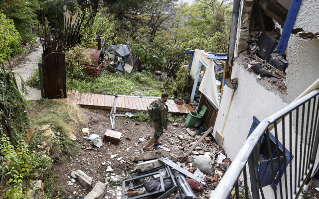 An Israeli soldier walks amid the rubble of a house hit in a strike by Lebanon's Hezbollah terror group, in Kibbutz Manara in northern Israel near the Lebanon border, on November 27, 2023. (Jalaa Marey / AFP)