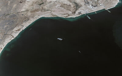 This handout satellite picture released by Maxar Technologies on November 28, 2023, shows the recently seized Israeli-linked Galaxy Leader ship (C), that was captured by Houthi rebels on November 19, next to a support vessel in the southern Red Sea near Hodeida, Yemen. (Photo by Satellite image ©2023 Maxar Technologies / AFP)