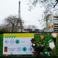Flowers where a German tourist was stabbed to death by an Islamist, near the Eiffel Tower, in Paris, December 3, 2023. (Dimitar DILKOFF / AFP)