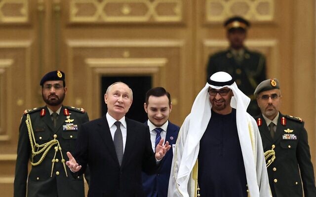 This pool photograph distributed by Russian state agency Sputnik shows Russia's President Vladimir Putin and President of the United Arab Emirates Sheikh Mohamed bin Zayed Al Nahyan attending a welcoming ceremony ahead of their talks in Abu Dhabi on December 6, 2023. (Sergei SAVOSTYANOV / POOL / AFP)