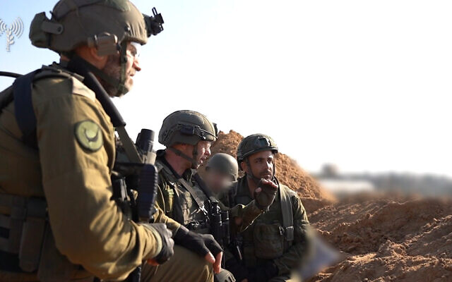 Head of the IDF Southern Command, Maj. Gen. Yaron Finkelman (center), speaks to forces in the southern Gaza Strip, December 6, 2023. (Israel Defense Forces)