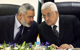 FILE - Palestinian Authority President Mahmoud Abbas, right, and then-Palestinian Authority Prime Minister Ismail Haniyeh of Hamas in Gaza City, March 18, 2007. (AP Photo/Khalil Hamra, File)