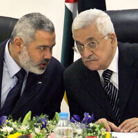 FILE - Palestinian Authority President Mahmoud Abbas, right, and Palestinian Authority Prime Minister Ismail Haniyeh of Hamas in Gaza City, March 18, 2007. (AP Photo/Khalil Hamra, File)