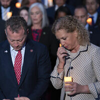 Rep. Josh Gottheimer, D-N.J and Rep. Debbie Wasserman Schultz, D-Fla., along with other members of Congress have moment of silence as they host a candlelight vigil for Israel at the Capitol in Washington, October 12, 2023. (AP Photo/Jose Luis Magana)