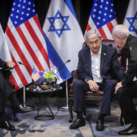 Prime Minister Benjamin Netanyahu, second right, confers with Defense Minister Yoav Gallant, right, during their meeting with US President Joe Biden, left, to discuss the war between Israel and Hamas, in Tel Aviv on October 18, 2023. (Miriam Alster/Pool Photo via AP)