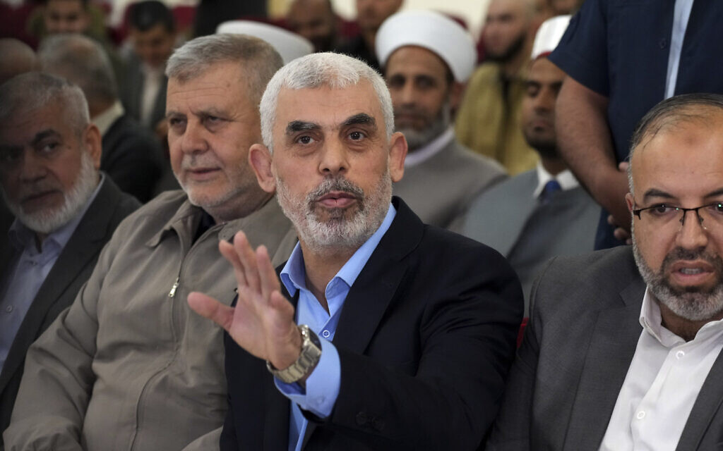 FILE - Yahya Sinwar, head of Hamas in Gaza, greets his supporters upon his arrival at a meeting in a hall on the sea side of Gaza City, on April 30, 2022. (AP Photo/Adel Hana, File)