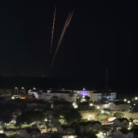 Rockets are fired toward Israel from the Gaza Strip as seen from southern Israel, December 2, 2023. (AP Photo/Leo Correa)