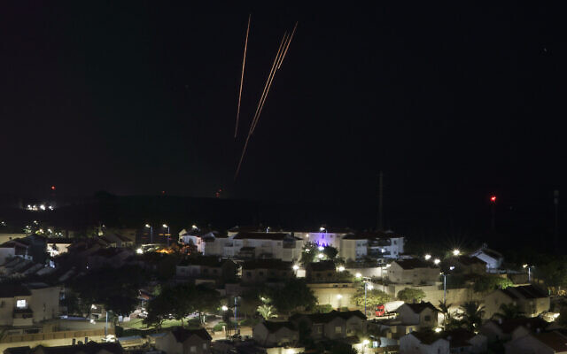 Rockets are fired toward Israel from the Gaza Strip as seen from southern Israel, December 2, 2023. (AP Photo/Leo Correa)