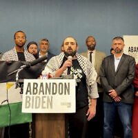 In this image taken from video, Muslim community leaders from several swing states pledge to withdraw support for US President Joe Biden on December 2, 2023, at a conference in Dearborn, Michigan, citing his refusal to call for a ceasefire in Gaza. (#AbandonBiden via AP)