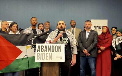 In this image taken from video, Muslim community leaders from several swing states pledge to withdraw support for US President Joe Biden on December 2, 2023, at a conference in Dearborn, Michigan, citing his refusal to call for a ceasefire in Gaza. (#AbandonBiden via AP)