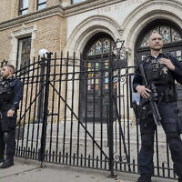 File: Hoboken Police officers stand watch outside the United Synagogue of Hoboken, New Jersey, November 3, 2022. (AP Photo/Ryan Kryska)